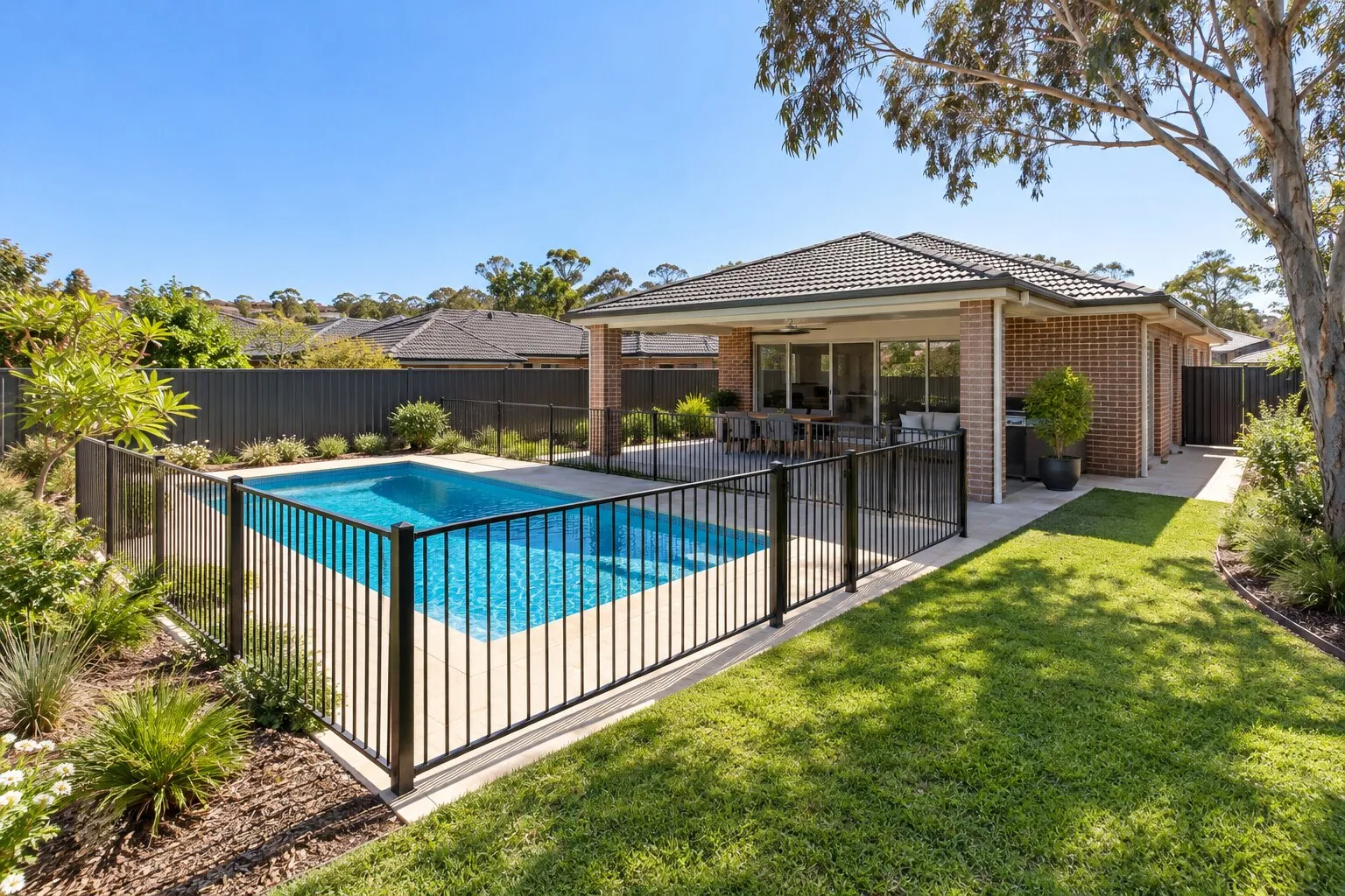 Selling a house with a pool, Sydney: fenced in-ground pool in a suburban back garden